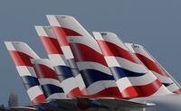 FILE PHOTO: Tail Fins of British Airways planes are seen parked at Heathrow airport as the spread of the coronavirus disease (COVID-19) continues, London, Britain, March 31, 2020. REUTERS/Toby Melville/