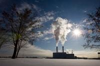 Smoke pours from the stacks at the Portlands Energy Centre, in Toronto, on Jan. 15, 2009.