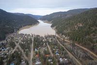 A swollen Otter Lake is pictured in Tulameen, B.C., Friday, Dec. 3, 2021. A new climate-based analysis predicts floods, droughts and major storms could cost Canada's economy $139 billion over the next 30 years. THE CANADIAN PRESS/Jonathan Hayward