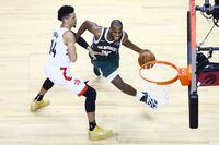 TORONTO, ONTARIO - MAY 19: Khris Middleton #22 of the Milwaukee Bucks drives to the basket against Danny Green #14 of the Toronto Raptors during the second half in game three of the NBA Eastern Conference Finals at Scotiabank Arena on May 19, 2019 in Toronto, Canada. NOTE TO USER: User expressly acknowledges and agrees that, by downloading and or using this photograph, User is consenting to the terms and conditions of the Getty Images License Agreement. (Photo by Vaughn Ridley/Getty Images)