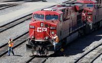 A Canadian Pacific Railway crew works on their train at the CP Rail yards in Calgary in April of 2014.