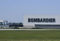 (FILES) In this file photo a Bombardier hangar is seen on the tarmac at the Montreal Pierre Elliott Trudeau International Airport July 4, 2018. - Bombardier said March 24, 2020 it will halt its aircraft and trains assembly lines in Canada after Quebec and Ontario ordered all non-essential businesses shut to stem the coronavirus pandemic. The measure was to take effect at 11:59 pm (0359 GMT Wednesday) and last until April 26, according to a statement."This suspension includes Bombardier's aircraft and rail production activities in the provinces of Quebec and Ontario," it said. (Photo by Eva HAMBACH / AFP) (Photo by EVA HAMBACH/AFP via Getty Images)