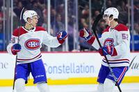 Montreal Canadiens' Jesse Ylonen, left, and Justin Barron celebrate after Ylonen's goal during the third period of an NHL hockey game against the Philadelphia Flyers, Friday, Feb. 24, 2023, in Philadelphia. (AP Photo/Matt Slocum)