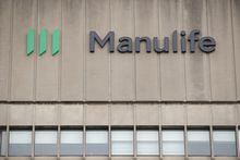 Signage is seen on Manulife Financial Corp.'s office tower in Toronto, Tuesday, Feb. 11, 2020. THE CANADIAN PRESS/Cole Burston