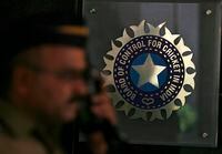 FILE PHOTO: A policeman walks past a logo of the Board of Control for Cricket in India (BCCI) during a governing council meeting of the Indian Premier League (IPL) at BCCI headquarters in Mumbai April 26, 2010. REUTERS/Arko Datta