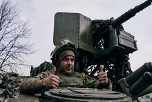 A Ukrainian soldier gives thumbs up from an APC near Bakhmut, the site of the heaviest battles, Donetsk region, Ukraine, Tuesday, March 7, 2023. (AP Photo/Libkos)