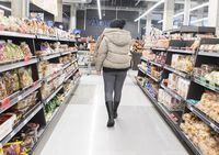 People shop at a grocery store in Montreal, Sunday, December 19, 2021.