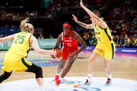 OCT 1, 2022; Sydney, [NSW], AUS;  Laeticia Amihere (15) dribbles between Cayla George (15) and Lauren Jackson (25) in first quarter  at Sydney SuperDome. Mandatory Credit: Yukihito Taguchi-USA TODAY Sports