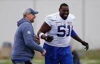 Winnipeg Blue Bombers head coach Mike O'Shea jokes around with Jermarcus Hardrick (51) during practice at training camp in Winnipeg Thursday, May 19, 2022. THE CANADIAN PRESS/John Woods