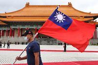 A soldier holds a Taiwan flag as part of the decoration at a welcome  ceremony for Palau President Surangel Whipps in Taipei, Taiwan, October 6, 2022. REUTERS/Ann Wang