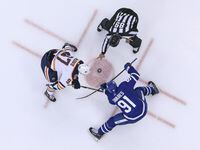 TORONTO, ON - FEBRUARY 27:  Connor McDavid #97 of the Edmonton Oilers takes a faceoff against John Tavares #91 of the Toronto Maple Leafs during an NHL game at Scotiabank Arena on February 27, 2019 in Toronto, Ontario, Canada. The Maple Leafs defeated the Oilers 6-2. (Photo by Claus Andersen/Getty Images)
