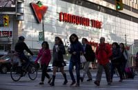 FILE PHOTO: People walk by a Canadian Tire Store in downtown Toronto, May 14, 2015. Retailer Canadian Tire Corp reported a better-than-expected quarterly profit, helped by strong sales of home products, sports gear and clothes. Same-store sales rose 4.7 percent in the first quarter at Canadian Tire stores, which sell home and automotive products.    REUTERS/Mark Blinch/File Photo