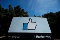In this April 14, 2020 file photo, the thumbs up Like logo is shown on a sign at Facebook headquarters in Menlo Park, Calif.