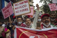 File - Members of Communist Party of India shout slogans during a protest against farm laws in Mumbai, India Monday, Sept. 27, 2021. Prime Minister Narendra Modi, on Friday, Nov. 19, 2021, has said his government will withdraw the controversial farm laws that were met with year-long demonstrations from tens of thousands of farmers who said the laws will shatter their livelihoods. The drawn-out demonstrations have posed one of the biggest political challenges to  Modi, who swept the polls for the second time in 2019. (AP Photo/Rafiq Maqbool, File)