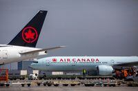 FILE PHOTO: Air Canada planes are parked at Toronto Pearson Airport in Mississauga, Ontario, Canada April 28, 2021. REUTERS/Carlos Osorio/File Photo