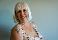 Monica Hamilton shows off her tattoos in Sylvan Lake, Alberta, Canada February 11, 2022.  Todd Korol/The Globe And Mail