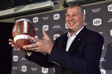 Randy Ambrosie tosses a football as he speaks during a press conference in Toronto on July 5, 2017. The Canadian Football League's commissioner will be in Halifax Friday, for what's expected to be a morale booster to those hoping the city will gain a professional team. Randy Ambrosie issued a news release noting the league has made the Nova Scotia capital the sole non-franchise city on his national tour. THE CANADIAN PRESS/Frank Gunn