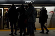 Passengers wait to board a subway car in Toronto on Friday, January 27, 2023. THE CANADIAN PRESS/Chris Young
