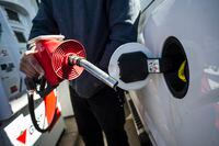 A man fills up his truck with gas in Toronto, on April 1, 2019. Statistics Canada says retail sales edged up 0.1 per cent in April to $51.5 billion in April, boosted by higher prices for gasoline and new car sales. THE CANADIAN PRESS/Christopher Katsarov