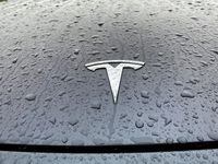 FILE PHOTO: A view shows the Tesla logo on the hood of a car in Oslo, Norway Nov. 10, 2022. REUTERS/Victoria Klesty//File Photo