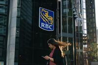 A woman walks past a Royal Bank of Canada sign in the financial district in Toronto on Tuesday, Sept. 20, 2022. BDC today announced the launch of Thrive Venture Fund and Lab for Women, a $500-million investment platform that will support the growth and economic impact of Canadian women-led businesses. THE CANADIAN PRESS/Alex Lupul