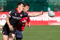 Britain's Morgan Williams, right, and Canada's Nicholas Allen, left, battle for the ball during an HSBC Canada Sevens semifinal rugby match in Edmonton, Alberta, Sunday, Sept. 26, 2021. (Jason Franson/The Canadian Press via AP)