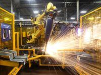FILE PHOTO: Robot welders on the floor of Alfield Industries, a subsidiary of Martinrea, one of three global auto parts makers in Canada, in Vaughan, Ontario, Canada April 28, 2017. Picture taken April 28, 2017. REUTERS/Fred Thornhill/File Photo