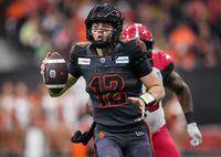 B.C. Lions quarterback Nathan Rourke runs with the ball during the first half of the CFL western semifinal football game against the Calgary Stampeders, in Vancouver, B.C., Sunday, Nov. 6, 2022. THE CANADIAN PRESS/Darryl Dyck