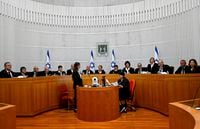All 15 of Israel's Supreme Court justices appear for the first time in the country's history to look at the legality of Prime Minister Benjamin Netanyahu's contentious judicial overhaul, which the government pushed through parliament in July, in Jerusalem, Tuesday, Sept. 12, 2023. The divisive law, which cancels the court's ability to block government actions and appointments using the legal concept that they are "unreasonable," is the first piece of the wider government plan to weaken the Supreme Court. (Debbie Hill/Pool Photo via AP)