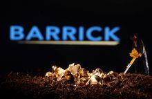 FILE PHOTO: A small toy figure and gold imitation are seen in front of the Barrick logo in this illustration taken November 19, 2021. REUTERS/Dado Ruvic/Illustration/File Photo