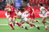 Canada's Renee Gonzalez, left, is tackled by United States' Sarah Levy during HSBC Canada Sevens women's semifinal rugby action, in Vancouver, on Sunday, September 19, 2021. THE CANADIAN PRESS/Darryl Dyck