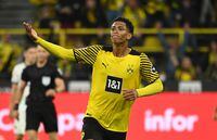 (FILES) Dortmund's English midfielder Jude Bellingham celebrates scoring the 2-1 goal with his team-mates during the German first division Bundesliga football match between Borussia Dortmund and TSG 1899 Hoffenheim in Dortmund, western Germany, on August 27, 2021. English teenager Jude Bellingham will move from Borussia Dortmund to Real Madrid for a fee in excess of 100 million euros (USD 107 million), the German side announced on June 7, 2023. (Photo by Ina Fassbender / AFP) / DFL REGULATIONS PROHIBIT ANY USE OF PHOTOGRAPHS AS IMAGE SEQUENCES AND/OR QUASI-VIDEO (Photo by INA FASSBENDER/AFP via Getty Images)