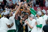 The Boston Celtics players raise the Eastern Conference trophy after defeating the Miami Heat in Game 7 of the NBA basketball Eastern Conference finals playoff series, Sunday, May 29, 2022, in Miami. (AP Photo/Lynne Sladky)