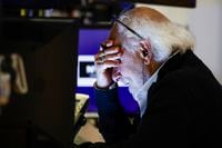 Trader Peter Tuchman reacts as he works on the floor at the New York Stock Exchange in New York, Monday, June 13, 2022. (AP Photo/Eduardo Munoz Alvarez)