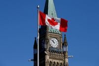 FILE PHOTO: Canadian flag flies in front of the Peace Tower on Parliament Hill in Ottawa, Ontario, Canada, March 22, 2017. REUTERS/Chris Wattie/File Photo