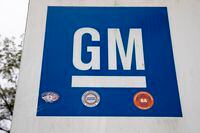 FILE - This Oct. 16, 2019, file photo shows a sign at a General Motors facility in Langhorne, Pa.  U.S. auto safety investigators have found no apparent defect with the passenger air bag seat sensors in thousands of older General Motors sedans. The National Highway Traffic Safety Administration denied a 2013 petition filed by a private crash investigator seeking a formal investigation of full-size cars including the Chevrolet Impala from the 2004 to 2010 model years.  (AP Photo/Matt Rourke, File)