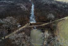 In this photo taken by a drone, cleanup continues in the area where the ruptured Keystone pipeline dumped oil into a creek in Washington County, Kan., Friday, Dec. 9, 2022. THE CANADIAN PRESS/AP-DroneBase