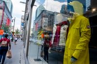 MONTREAL, Que. (08/11/2020) – People walk in front of the Canada Goose Store on Sainte-Catherine Street in Montreal, Que. on Aug. 11, 2020.  (Andrej Ivanov/The Globe and Mail)