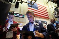 Traders work on the floor of the New York Stock Exchange (NYSE) in New York City, U.S., October 17, 2022. REUTERS/Brendan McDermid