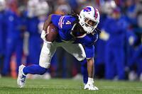 Buffalo Bills running back James Cook (4) runs with the ball during the first half of an NFL football game against the Dallas Cowboys in Orchard Park, N.Y., Sunday, Dec. 17, 2023. (AP Photo/Adrian Kraus)