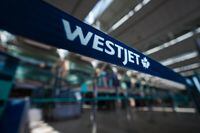 A WestJet logo is seen in the domestic check-in area at Vancouver International Airport, in Richmond, B.C., on Friday, May 19, 2023.The union representing WestJet cabin crew is demanding an apology from the airline after Conservative Leader Pierre Poilievre delivered a speech on the public address system of a recent flight.&nbsp;THE CANADIAN PRESS/Darryl Dyck