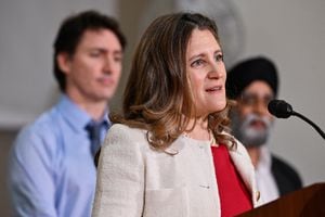 Canada's Prime Minister Justin Trudeau and the Minister of Emergency Preparedness Harjit S. Sajjan listen as Deputy Prime Minister and Minister of Finance, Chrystia Freeland speaks at the Sunset Community Centre in Vancouver, British Columbia, Canada March 27, 2024.