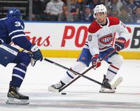 TORONTO, ON - APRIL 9:  Chris Wideman #20 of the Montreal Canadiens skates with the puck against Auston Matthews #34 of the Toronto Maple Leafs during an NHL game at Scotiabank Arena on April 9, 2022 in Toronto, Ontario, Canada. The Maple Leafs defeated the Canadiens 3-2.(Photo by Claus Andersen/Getty Images)