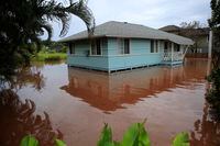 A house is surrounded by flood waters in Haleiwa, Hawaii, on March 9, 2021.