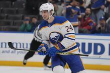 Buffalo Sabres' Dylan Cozens (24) smiles after scoring an empty-net goal during the third period of an NHL hockey game against the St. Louis Blues Tuesday, Jan. 24, 2023, in St. Louis. (AP Photo/Jeff Roberson)