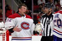 Montreal Canadiens goaltender Jake Allen (34) protests a delay-of-game penalty called against him by an official during the second period of the team's NHL hockey game against the Carolina Hurricanes in Raleigh, N.C., Thursday, March 31, 2022. (AP Photo/Karl B DeBlaker)