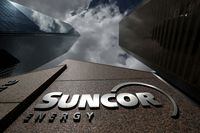FILE PHOTO: The Suncor Energy logo is seen at the company's head office in Calgary, Alberta, Canada, April 17, 2019. REUTERS/Chris Wattie/File Photo