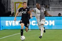 May 21, 2022; Washington, District of Columbia, USA; D.C. United defender Julian Gressel (31) dribbles the ball as Toronto FC forward Ayo Akinola (20) chases in the second half at Audi Field. Mandatory Credit: Geoff Burke-USA TODAY Sports