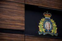 The RCMP logo is seen outside Royal Canadian Mounted Police "E" Division Headquarters, in Surrey, B.C., on Friday April 13, 2018. The RCMP says its major crimes unit is investigating the death of an infant in northern Alberta as a homicide. THE CANADIAN PRESS/Darryl Dyck