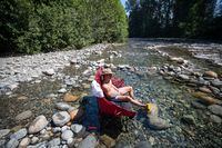 Albert Huynh cools off in Lynn Creek in North Vancouver, B.C., on June 28, 2021. Heat warnings have been posted across a much of British Columbia as Environment Canada predicts temperatures up to 40 C. THE CANADIAN PRESS/Darryl Dyck